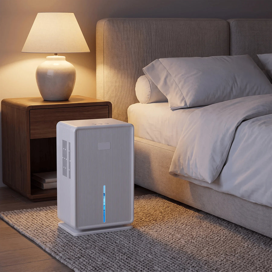 Ribbed compact dehumidifier next to the bed in a calm bedroom
