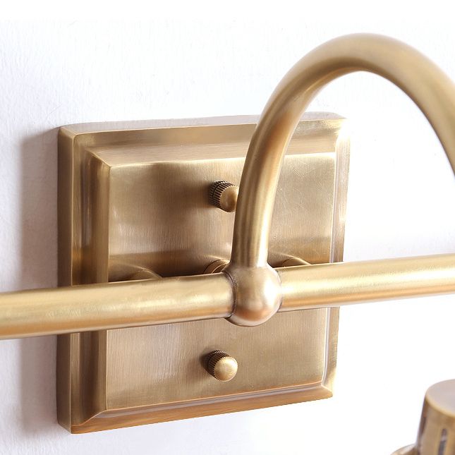 Antique brass prismatic glass vanity light