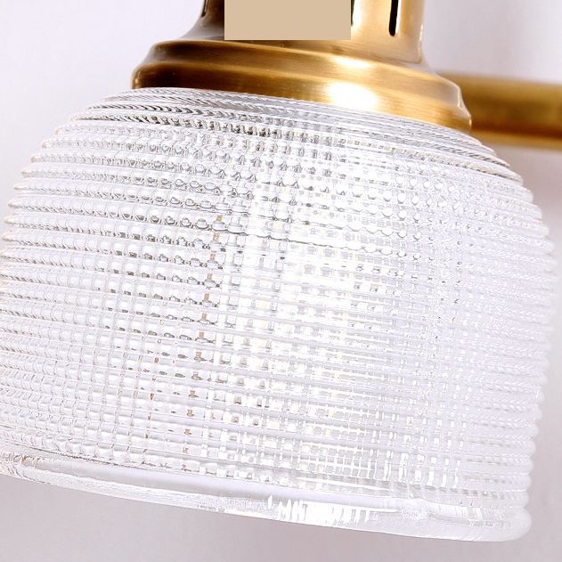 Antique brass prismatic glass vanity light
