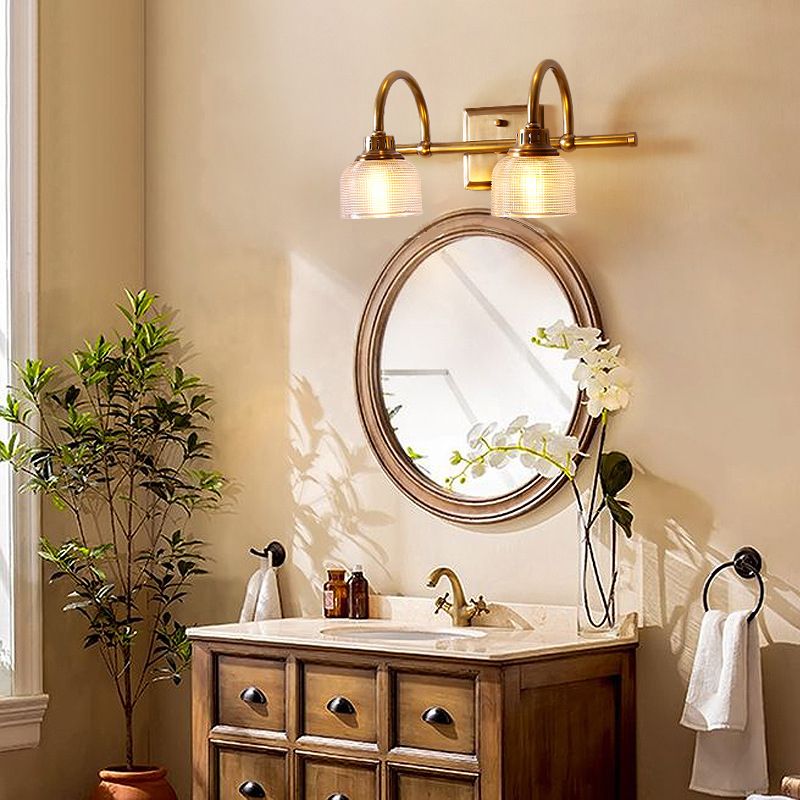 Antique brass prismatic glass vanity light