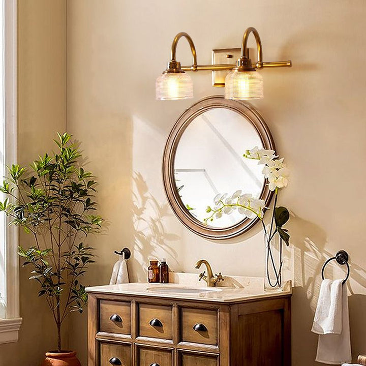 Antique brass prismatic glass vanity light