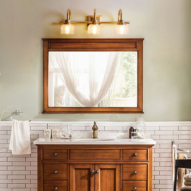 Antique brass prismatic glass vanity light