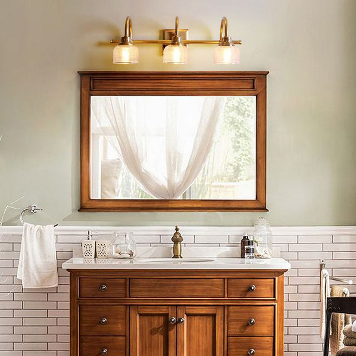 Antique brass prismatic glass vanity light