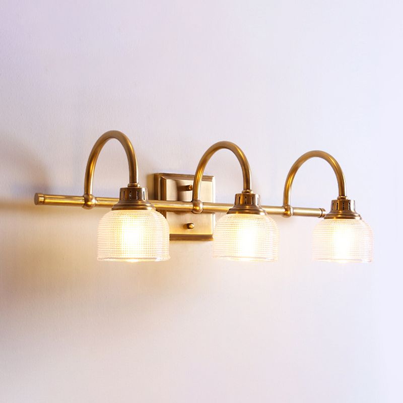 Antique brass prismatic glass vanity light