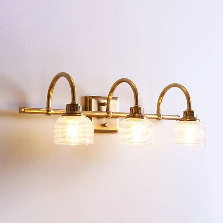 Antique brass prismatic glass vanity light