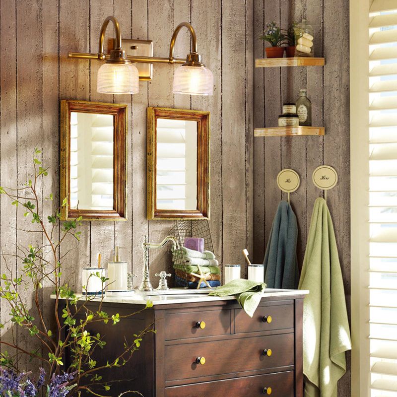 Antique brass prismatic glass vanity light