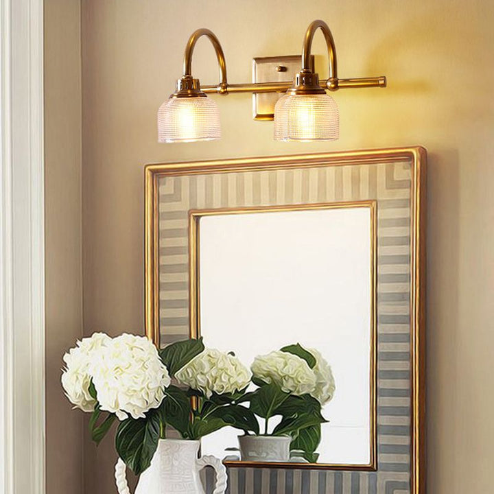 Antique brass prismatic glass vanity light