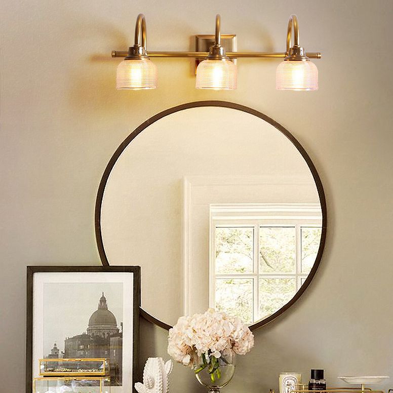 Antique brass prismatic glass vanity light