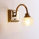 Antique brass prismatic glass vanity light