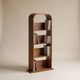Arched walnut media shelf for CDs and DVDs