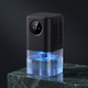 Halo mini dehumidifier in black on a green marble plinth