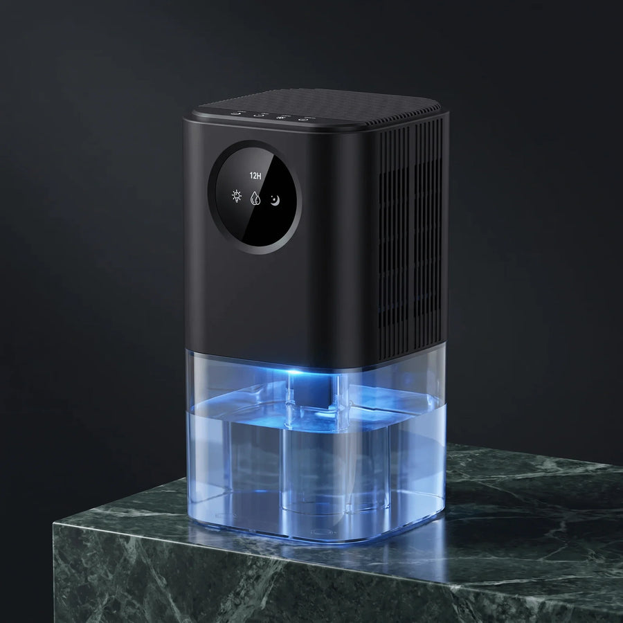 Halo mini dehumidifier in black on a green marble plinth