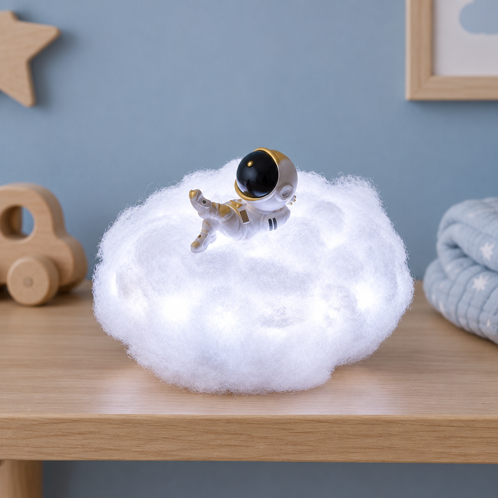 Astronaut cloud night light glowing on a nursery shelf