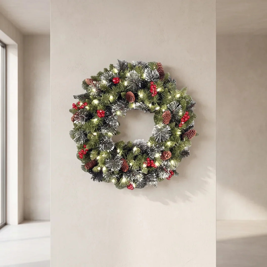 Pre-lit frosted pine Christmas wreath with berries and pine cones