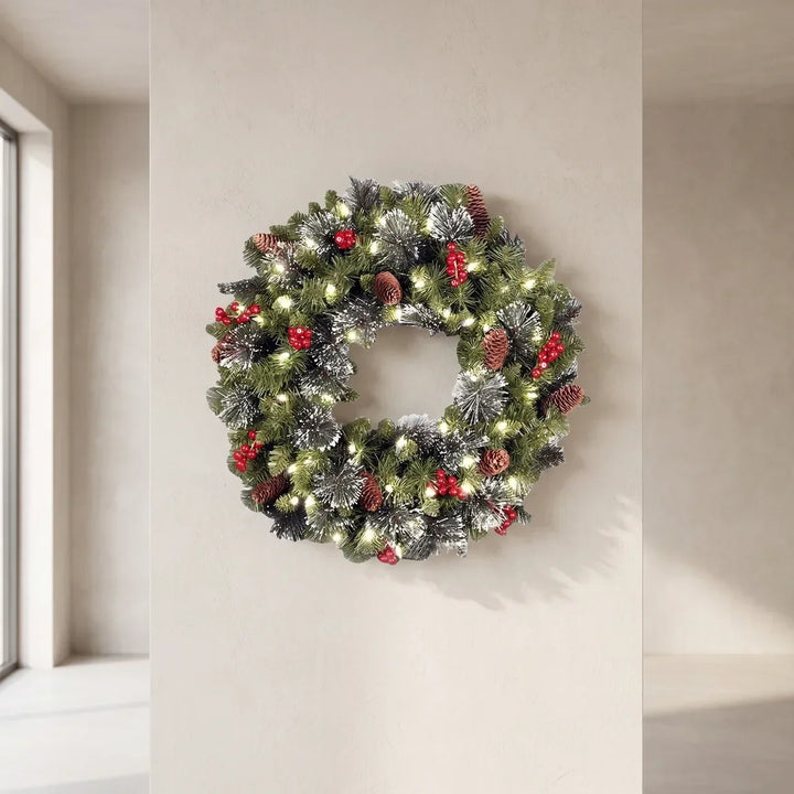 Pre-lit frosted pine Christmas wreath with berries and pine cones