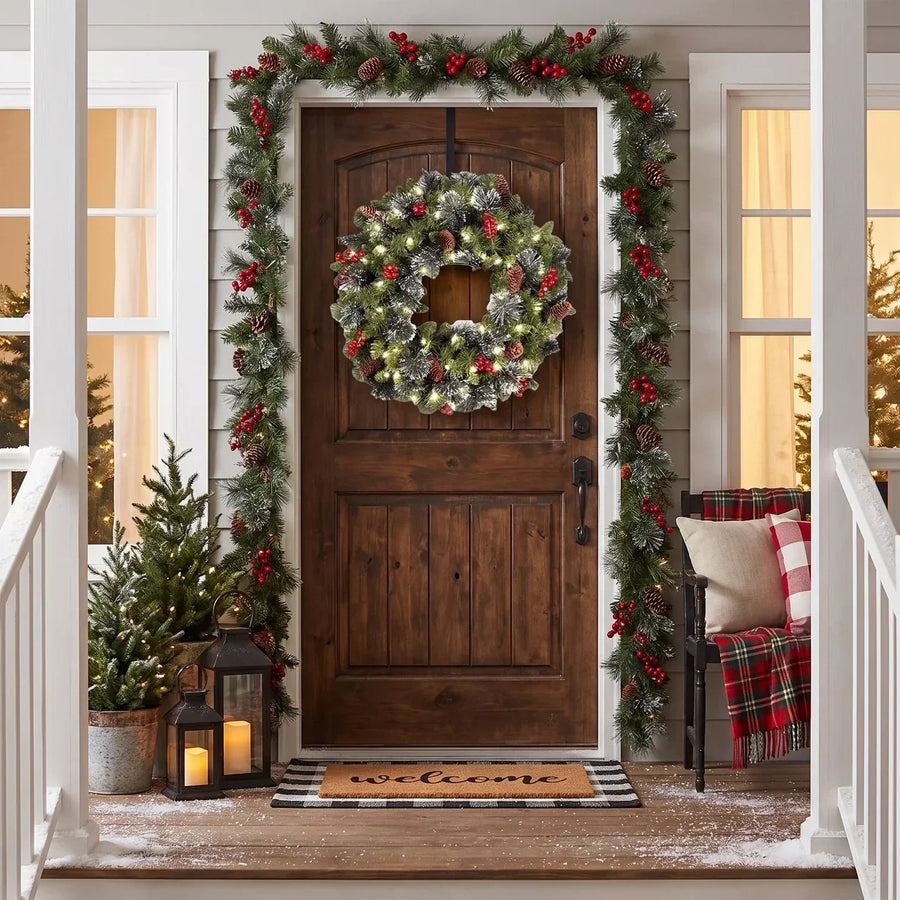 Pre-lit frosted pine Christmas wreath with berries and pine cones