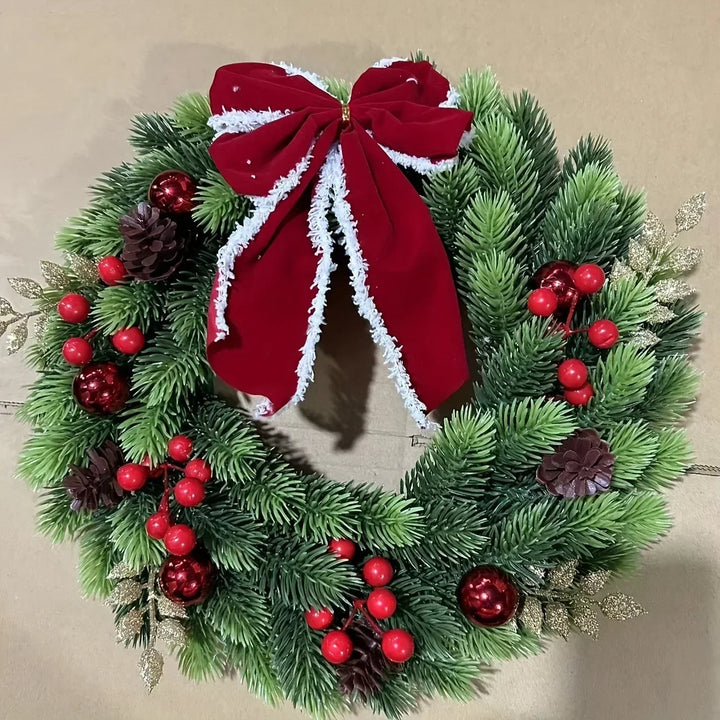 Christmas wreath with red velvet bow and baubles