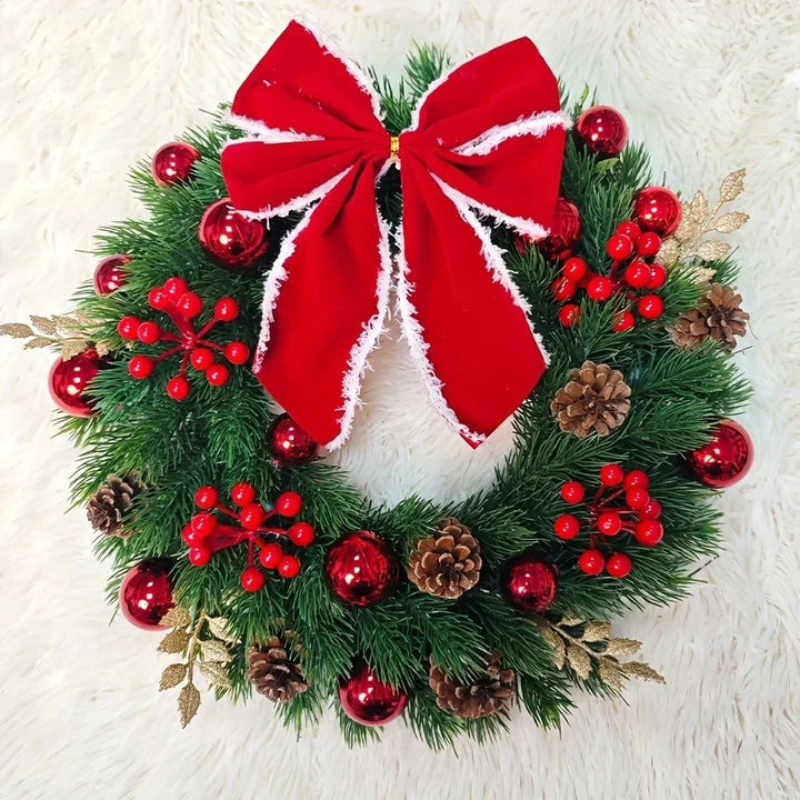 Christmas wreath with red velvet bow and baubles