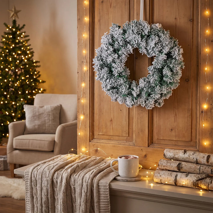 Snow-flocked pine Christmas wreath