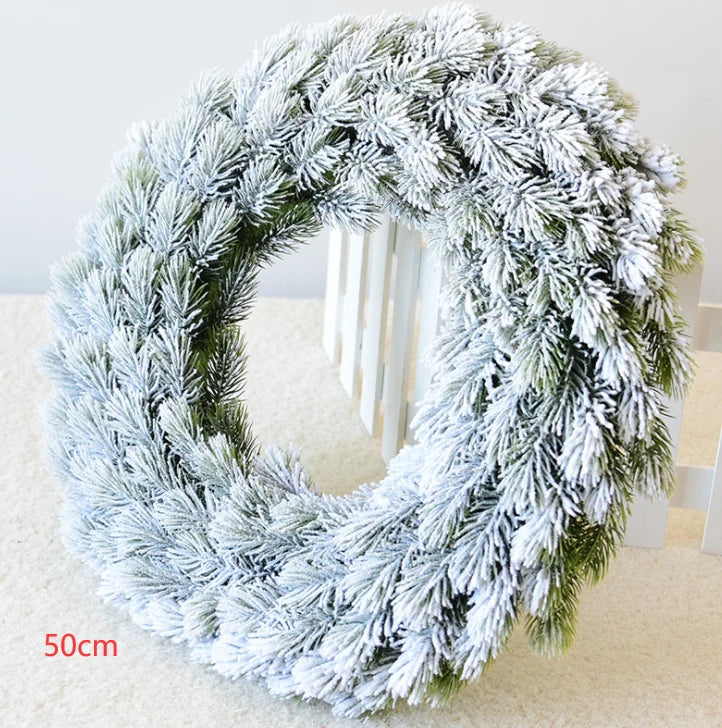 Snow-flocked pine Christmas wreath