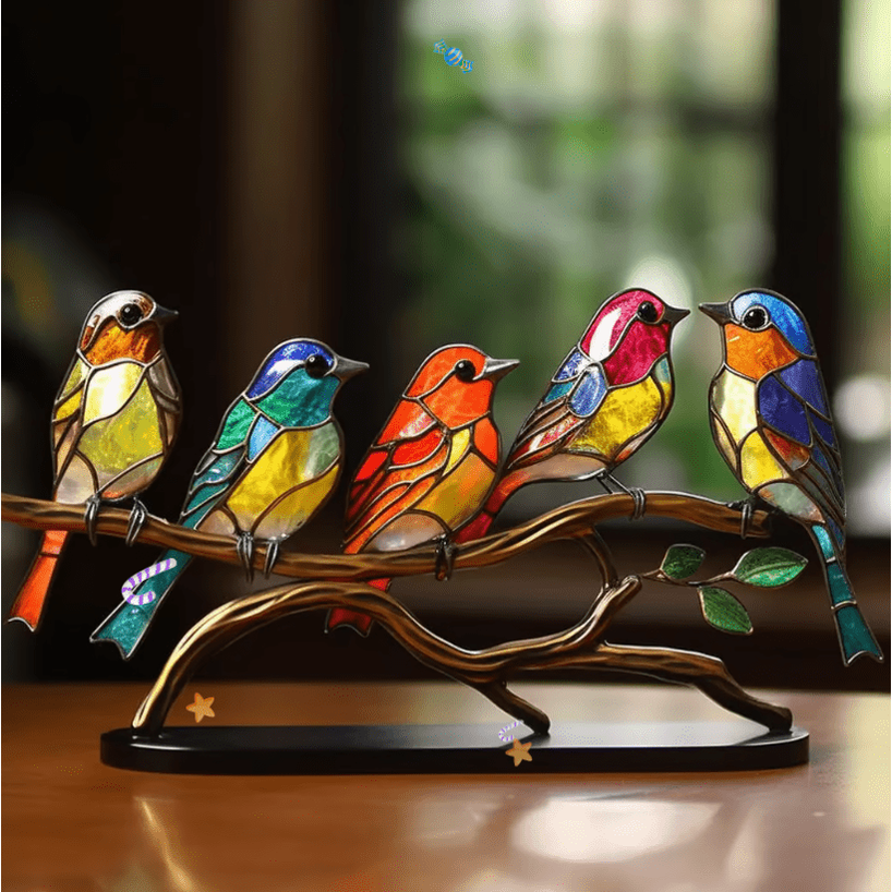 Stained glass bird ornament on bronze stand