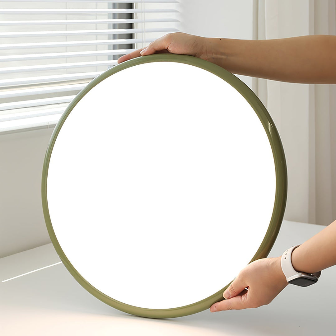 Tilting disc LED ceiling light