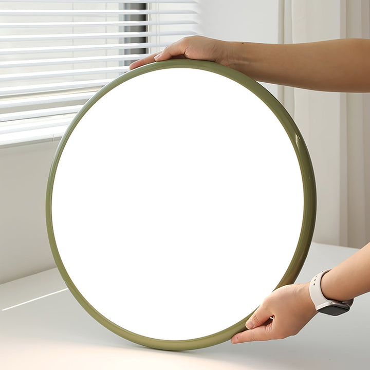 Tilting disc LED ceiling light